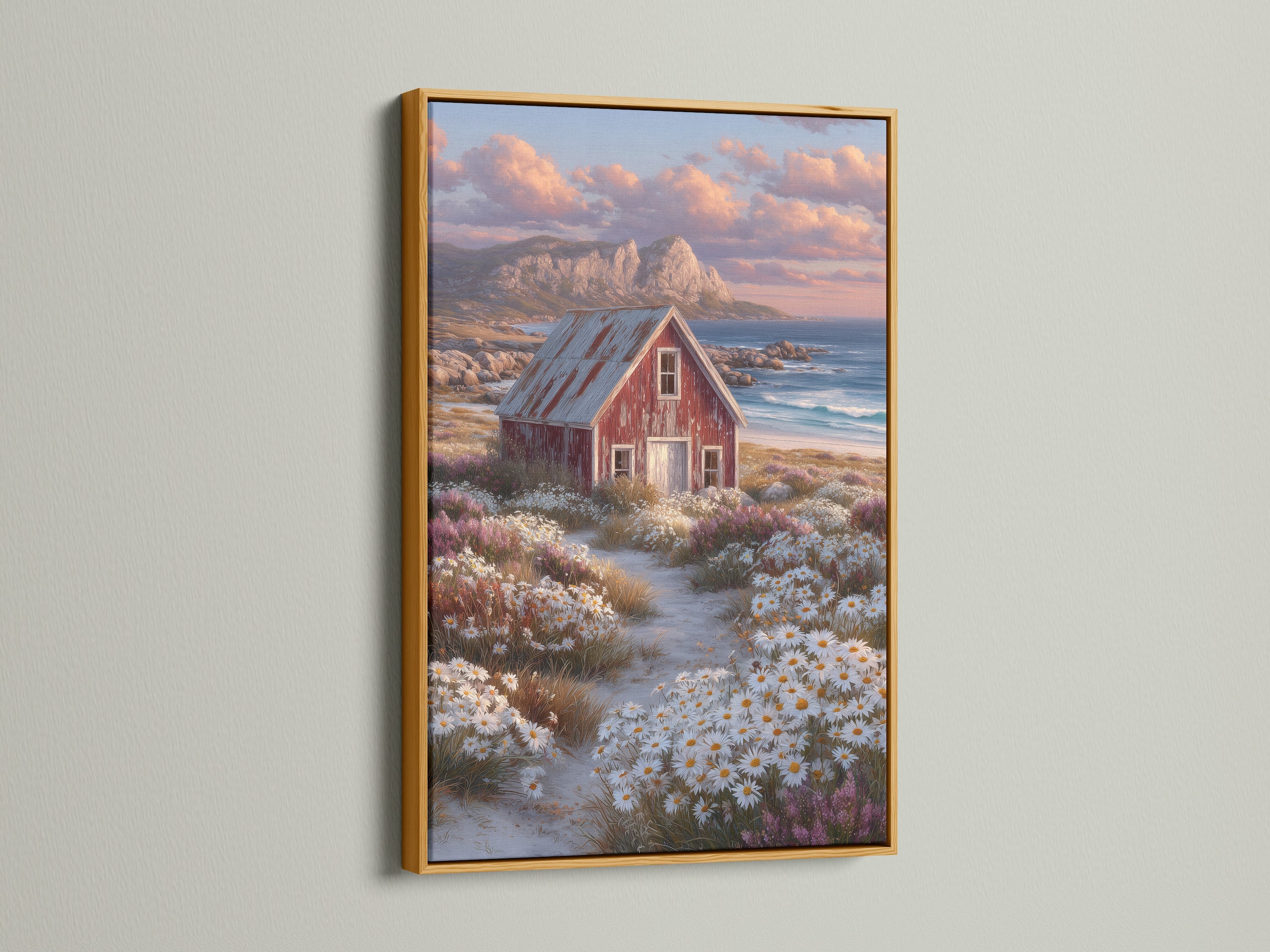Ocean view print featuring coastal cottage art and a rustic red barn. The artwork is displayed in a gold frame. This art brings warmth and style to your living space. Ideal for coastal and tropical style decor.