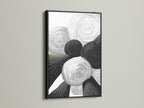 This geometric abstract art print features black and white circles. The art is encased in a sleek black frame. The contrast enhances the modern feel. Ideal for adding a sophisticated touch to your office or living space. This is contemporary art at its finest.