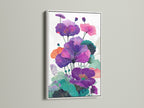 Floral Canvas Print with a White Frame. The white frame enhances the beauty of the purple botanical artwork. This modern canvas art brightens up living rooms bedrooms and offices. A vibrant floral display.