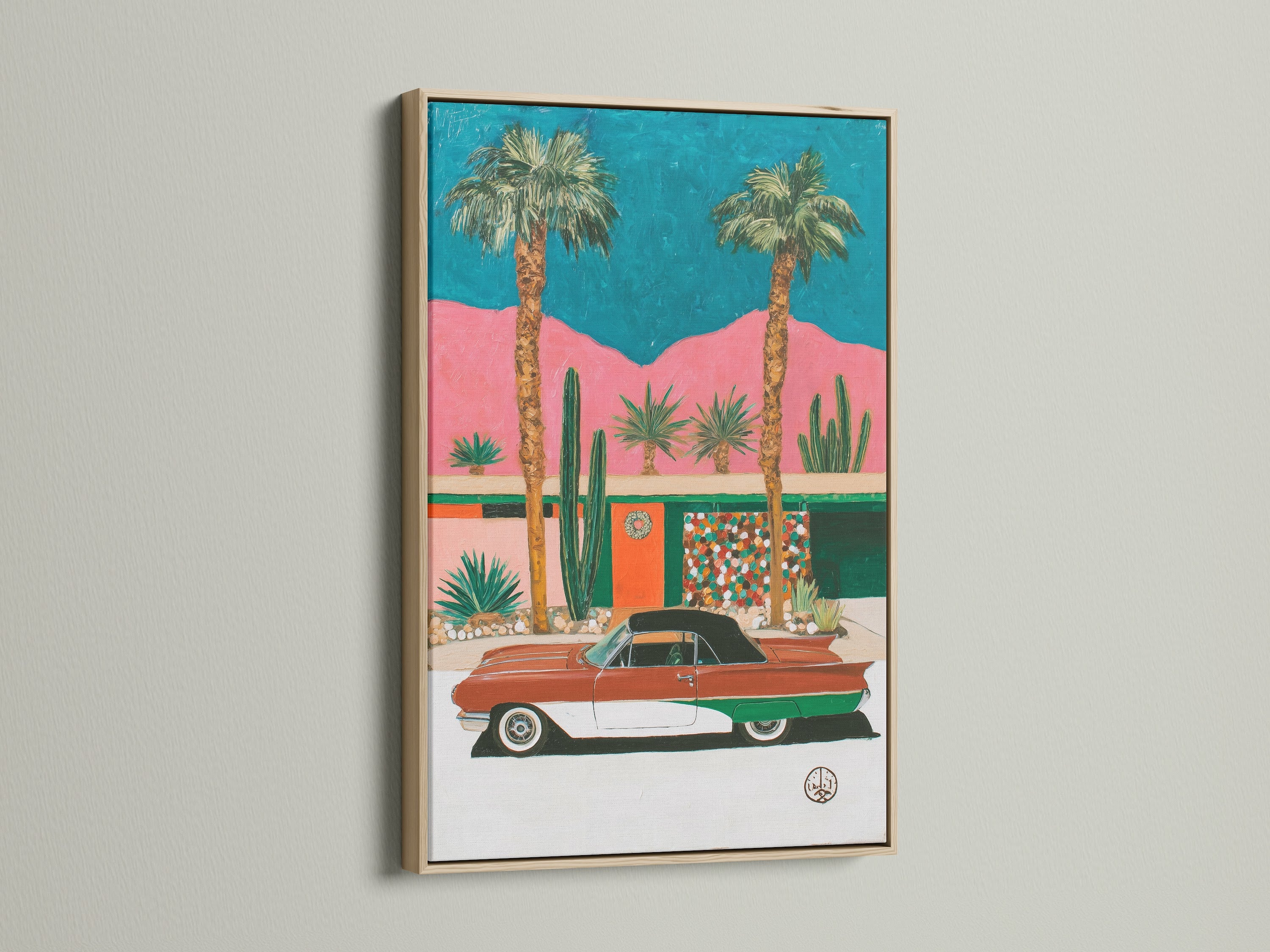 Retro Palm Springs artwork in an oak frame. This mid-century modern art piece brings vintage charm to any space. The artwork features a classic car and desert landscape. It is perfect for adding a touch of California style to your decor.