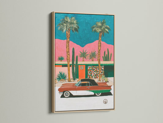 Retro Palm Springs artwork in an oak frame. This mid-century modern art piece brings vintage charm to any space. The artwork features a classic car and desert landscape. It is perfect for adding a touch of California style to your decor.