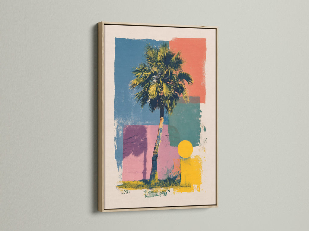 Artwork in an oak frame is mounted on a wall. The artwork includes a palm tree and geometric shapes in multiple colors. The oak frame adds a warm natural touch. Perfect for adding a piece of framed artwork to your home or office.