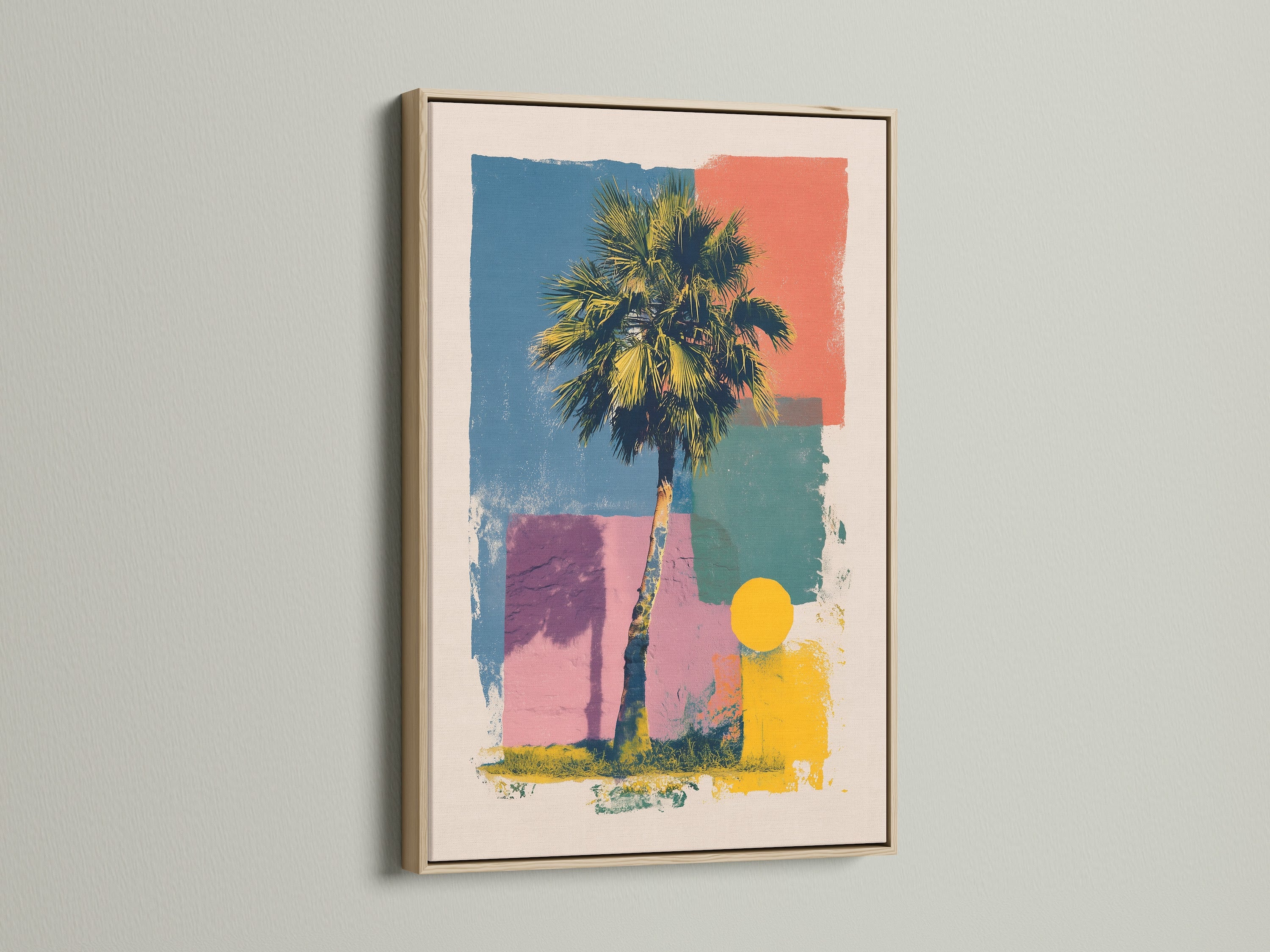 Artwork in an oak frame is mounted on a wall. The artwork includes a palm tree and geometric shapes in multiple colors. The oak frame adds a warm natural touch. Perfect for adding a piece of framed artwork to your home or office.