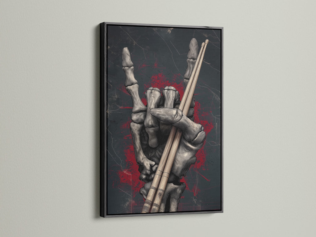Skeleton Hand Drumsticks artwork with a black frame. This gothic canvas art is ideal for music studio art. It's a dark academia print that captures the essence of rock culture. A great skeleton art print to celebrate unique artwork. It enhances studio decor.