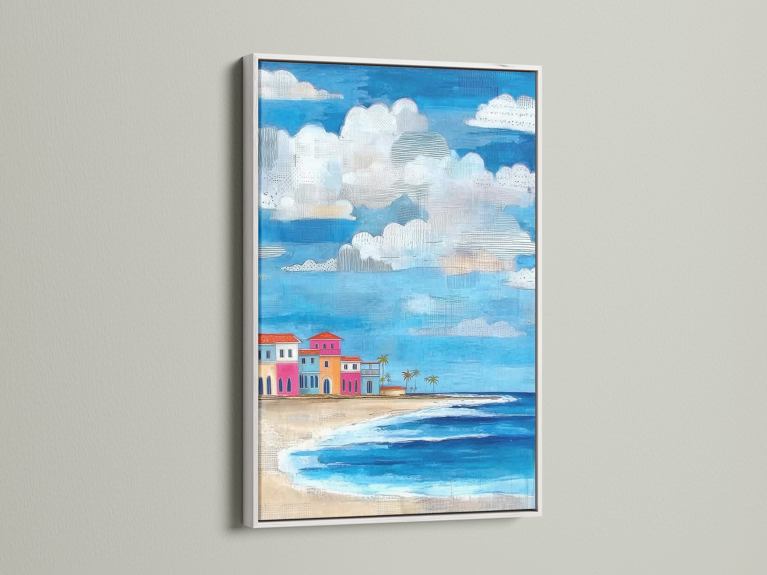 Coastal beach artwork with a white frame. The artwork showcases colorful beach houses. This tropical seascape wall art is perfect for any room. The white frame offers a clean look.
