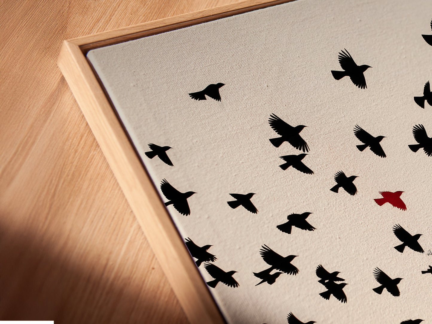 A close-up shows a canvas print in a floating frame. The artwork is a gothic cathedral. The birds in flight add dynamism. The floating frame gives a modern touch. Perfect for adding a unique piece of gothic wall art.