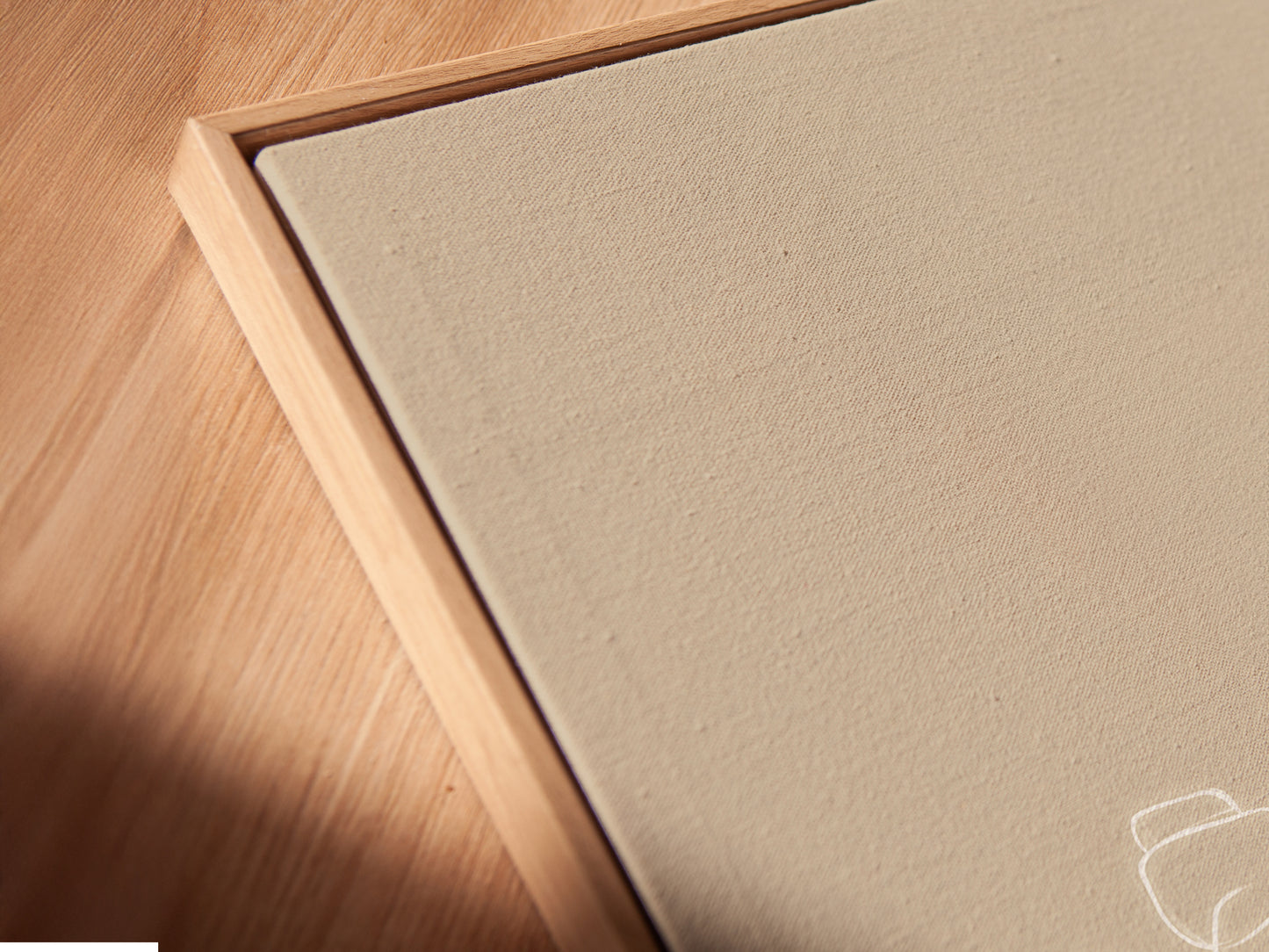 Close-up angled view of a Zen Stones canvas print in a floating frame.  The minimalist wall art adds a contemporary touch. Perfect as spa decor or calming artwork.  Elevate your bathroom artwork with this zen-inspired piece.