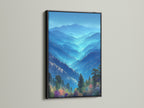 See a forest canvas featuring blue mountains in a black frame. This modern decor suits any space. The black frame accentuates the vibrant nature photography. Bring wilderness art into your living room or bedroom. This artwork offers tranquility.