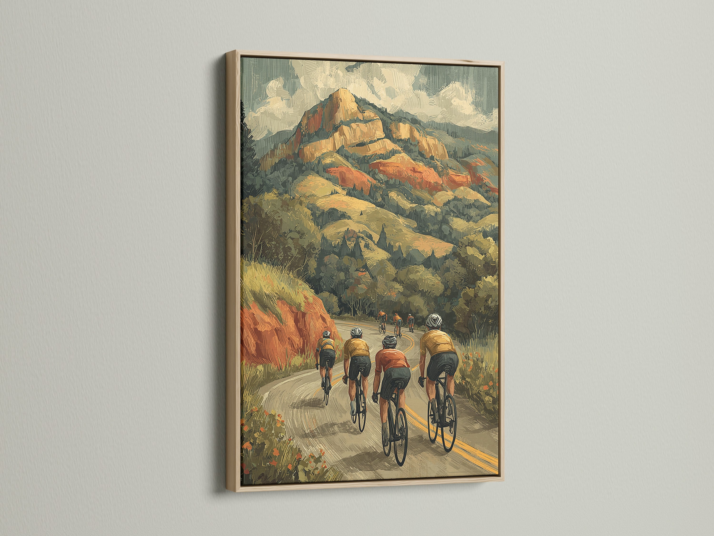 Cycling wall art with an oak frame. The artwork showcases cyclists climbing a winding mountain road. A vintage-inspired sports canvas art piece. Ideal for adding a rustic touch to your home or office. Discover our cycling wall art