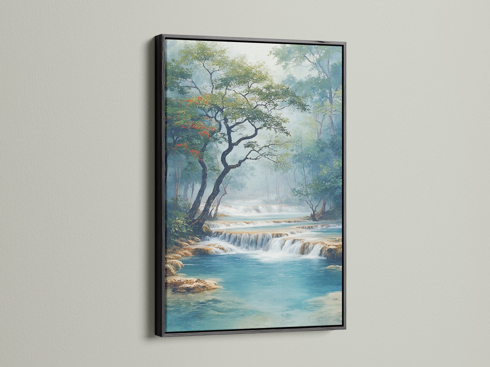 A black frame surrounds this stunning waterfall artwork. The contrast makes the turquoise river pop. This landscape artwork is great for contemporary spaces. Nature wall art at its finest with a modern touch.