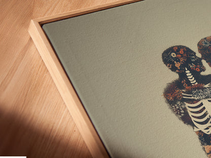 Close-up of a Floral Skeleton canvas print in a floating frame. The anatomy artwork is highlighted. This gothic canvas is a great addition to study room decor. Its moody artwork style stands out.