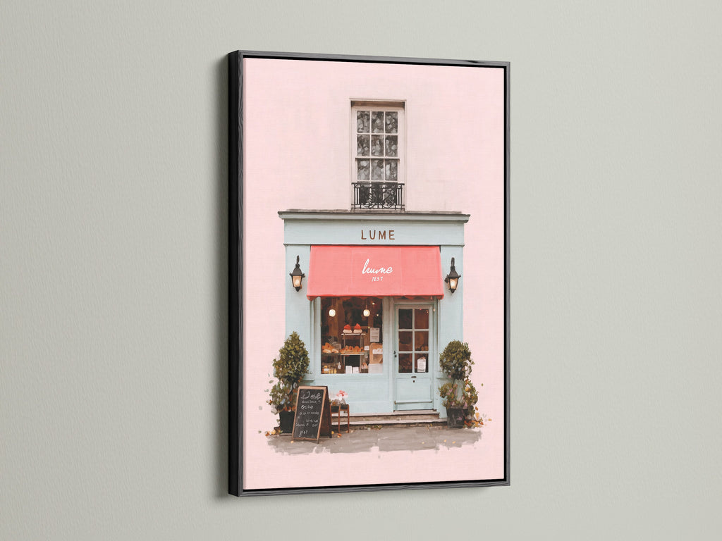 An eye-catching art print is displayed in a sleek black frame. The artwork shows a picturesque building with a pink facade and a bold red awning. The black frame adds a touch of drama and sophistication. It makes the artwork pop. This piece is perfect for creating a focal point in your home.