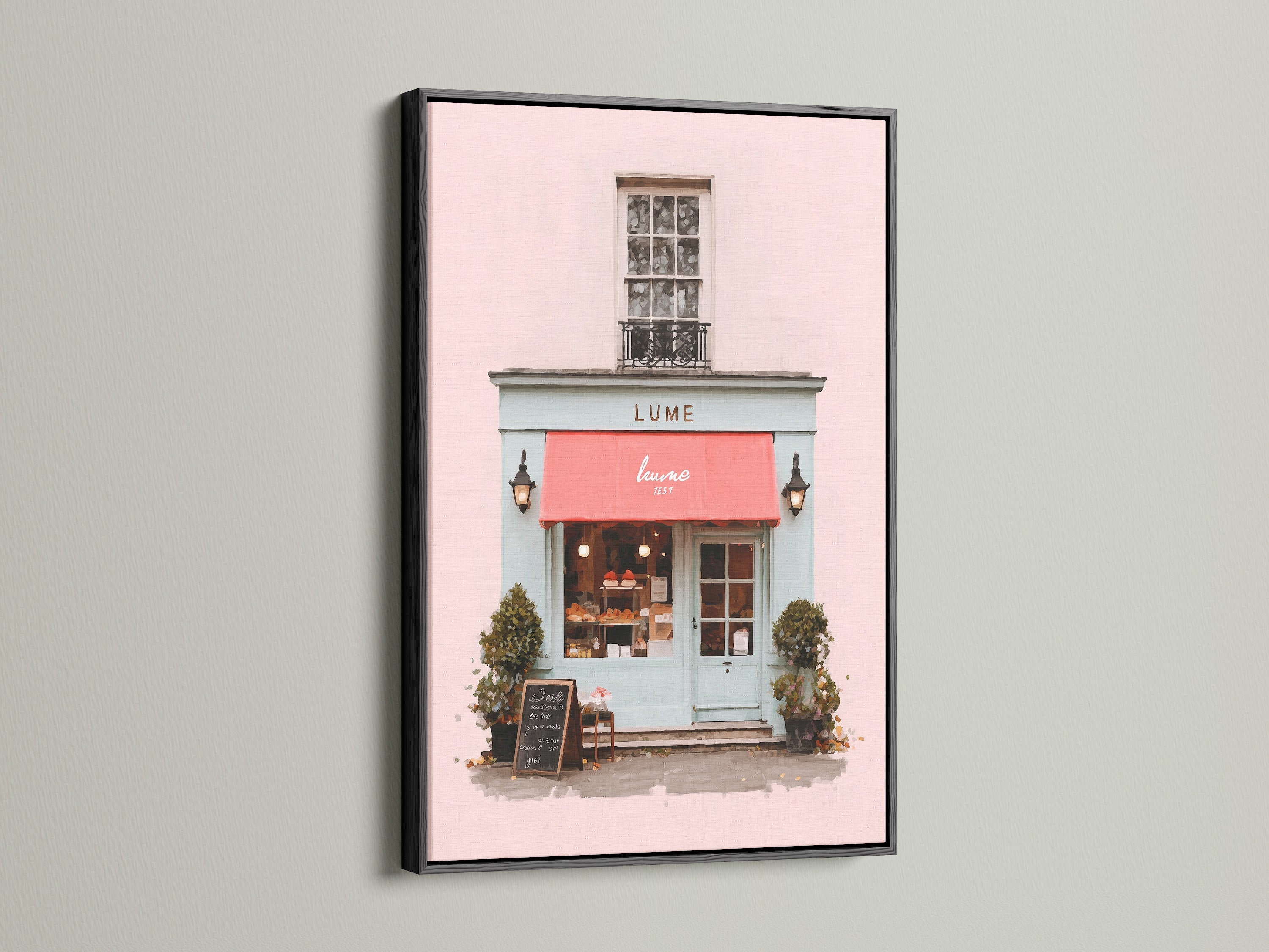 An eye-catching art print is displayed in a sleek black frame. The artwork shows a picturesque building with a pink facade and a bold red awning. The black frame adds a touch of drama and sophistication. It makes the artwork pop. This piece is perfect for creating a focal point in your home.