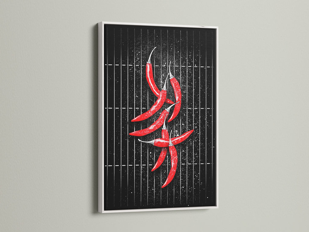 A red chili pepper artwork print framed in white. This artwork is a modern foodie poster for kitchen wall decor. The white frame offers a clean minimalist look. Red and black art that elevates any dining area. Perfect for studio decor.