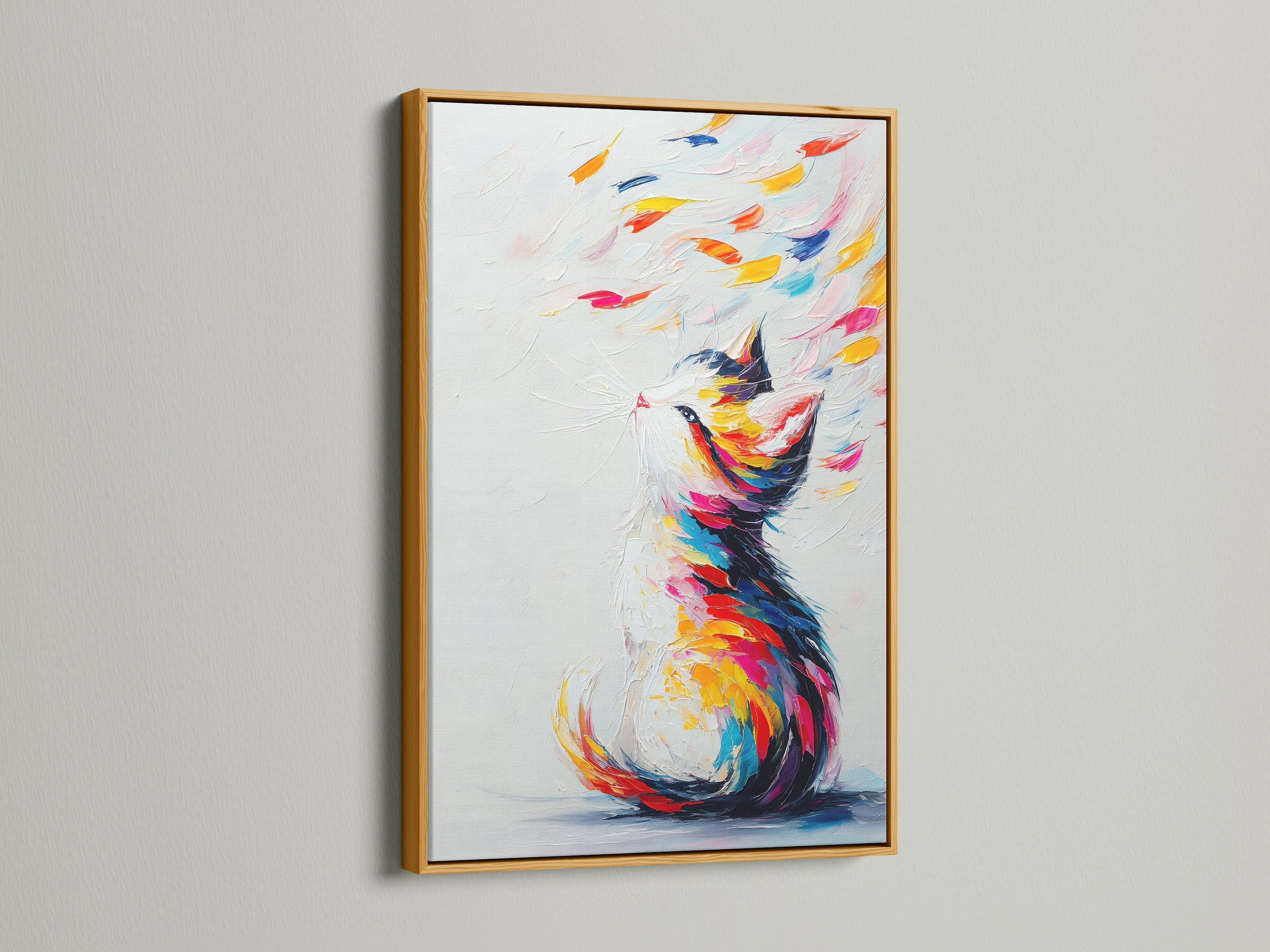 The image features a colorful cat artwork in a gold frame. This abstract pet print shines with modern elegance. The vibrant rainbow colors make it a standout piece. It's a perfect gift for pet lovers. Add a touch of luxury and joy to your home decor with this artwork.