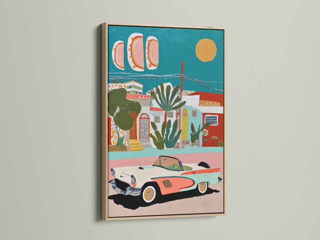 Mediterranean Village artwork with a vintage car. The artwork features coastal teal and coral colors that provide retro decor. The art print is displayed in an oak frame. It would be great for living rooms vacation homes boutique wall art studios or cafes.