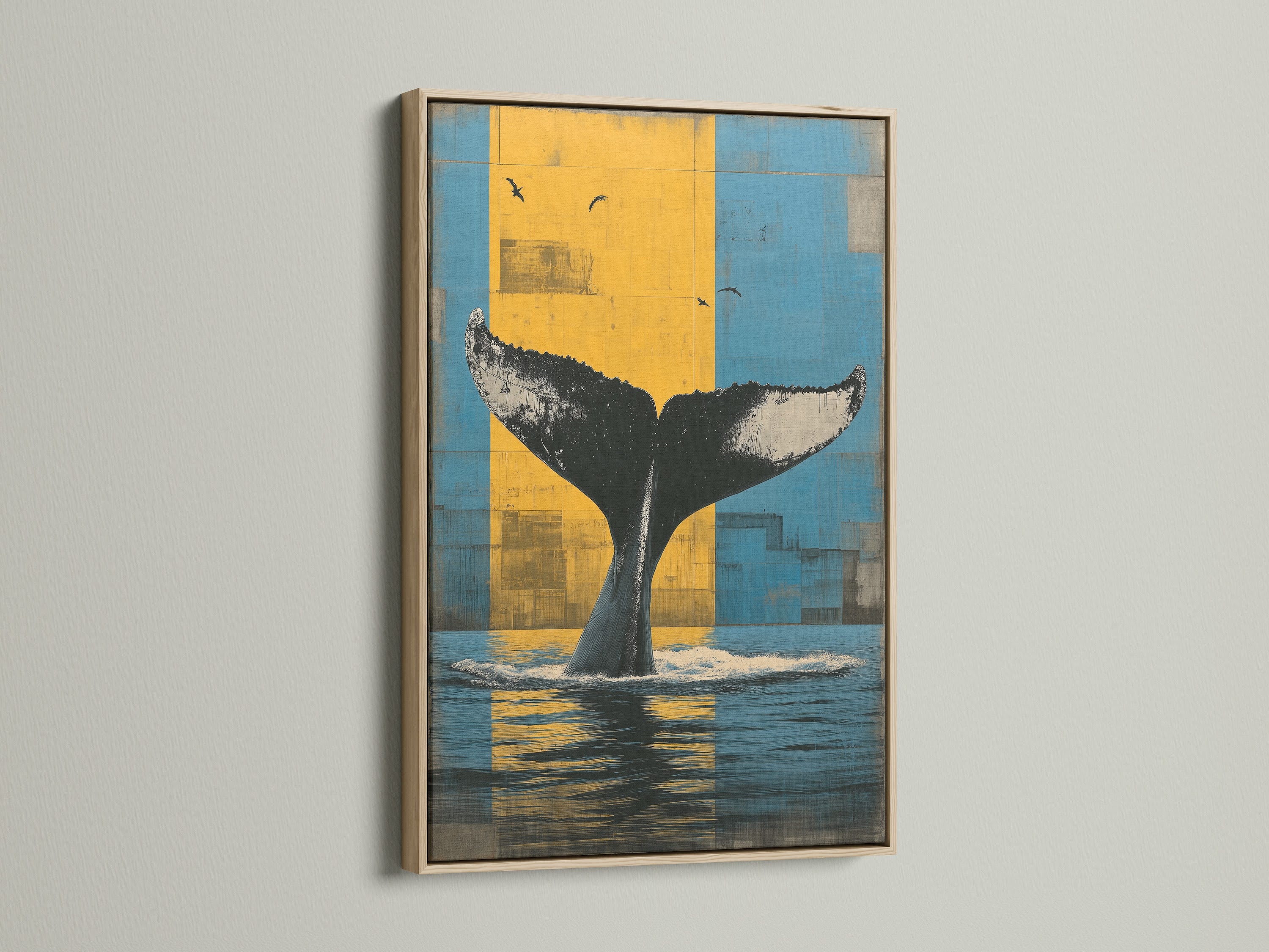 Whale Tail canvas print in an oak frame. This ocean wall art features a whale tail. The backdrop has blue and yellow hues. It is perfect for nautical wall art and coastal decor. This marine canvas enhances any space.