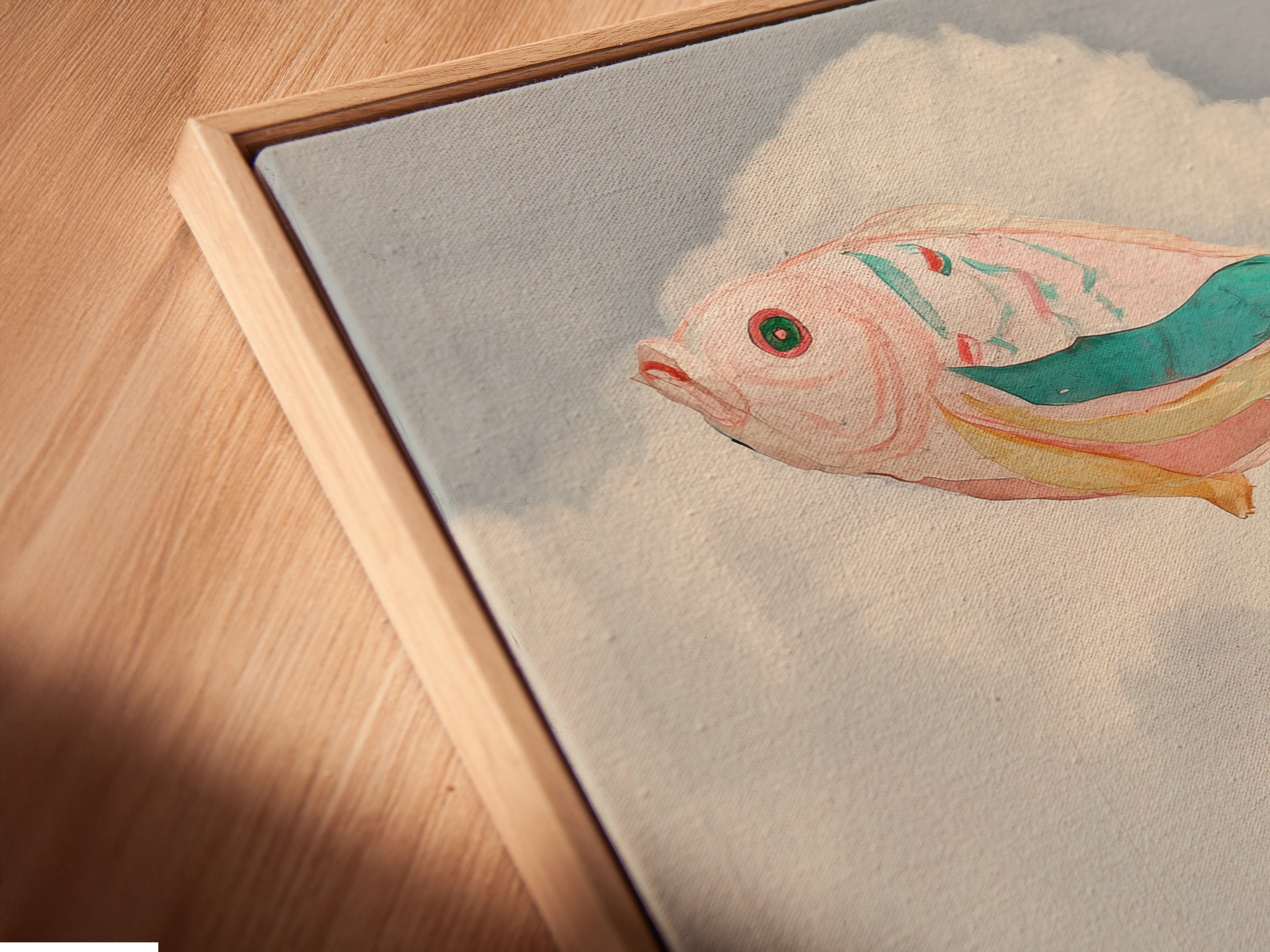 A close-up shows a canvas print in a floating frame. This surreal flying fish artwork is beautifully displayed. The floating frame enhances the airy feel. The pastel colors and whimsical artwork are highlighted. It is perfect for bedroom decor. The imaginative artwork adds a touch of fantasy to any space.