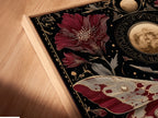 A close-up angled view reveals a canvas print in a floating frame. The celestial moth artwork blends with gothic botanical art. Moon phases create an alluring dark academia aesthetic. It's mystical artwork.