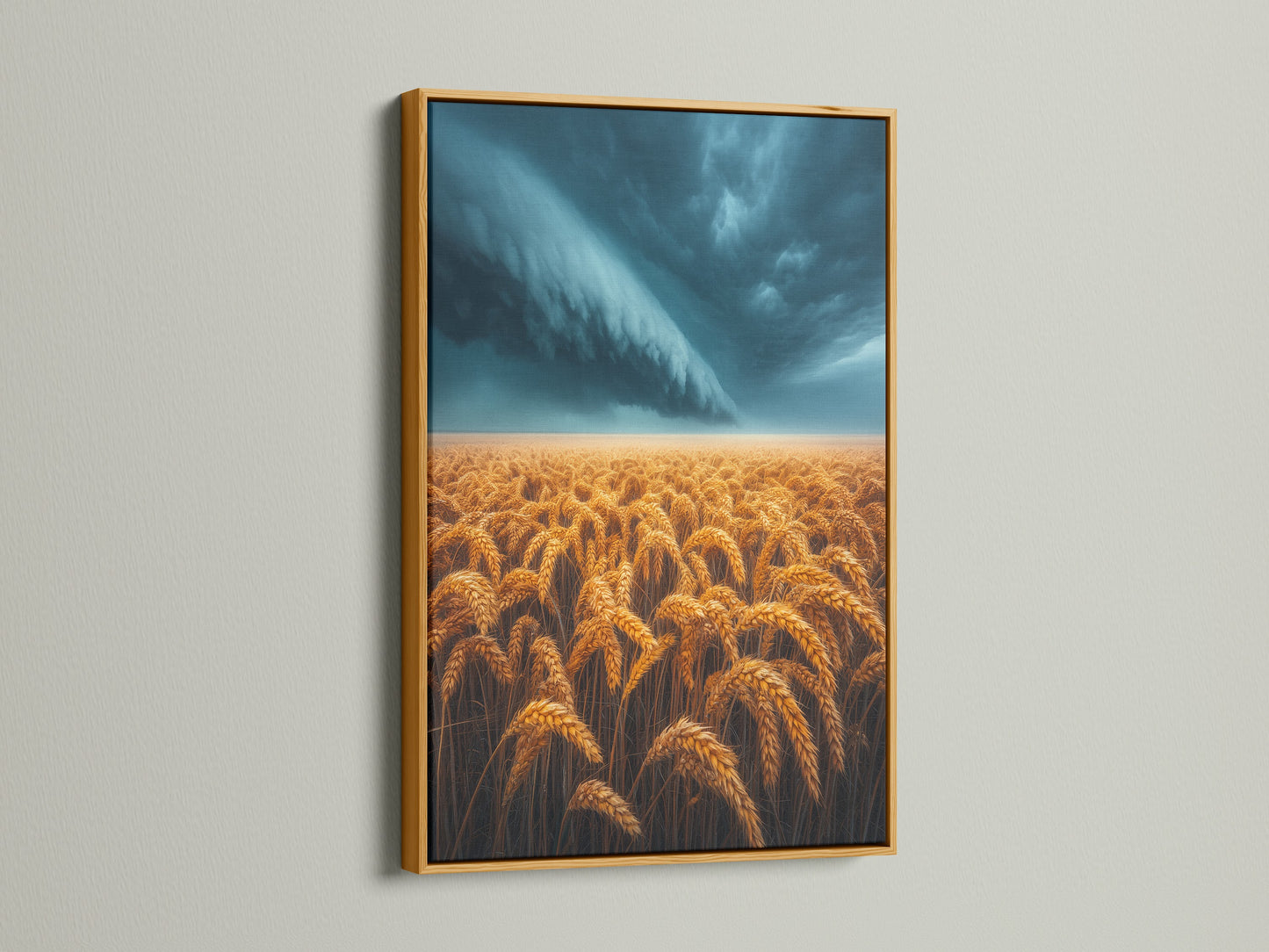 Wheat Field artwork in a gold frame. The artwork displays a golden wheat field beneath a stormy sky. This piece adds a touch of luxury to rustic themes. Great addition to Farmhouse wall art.