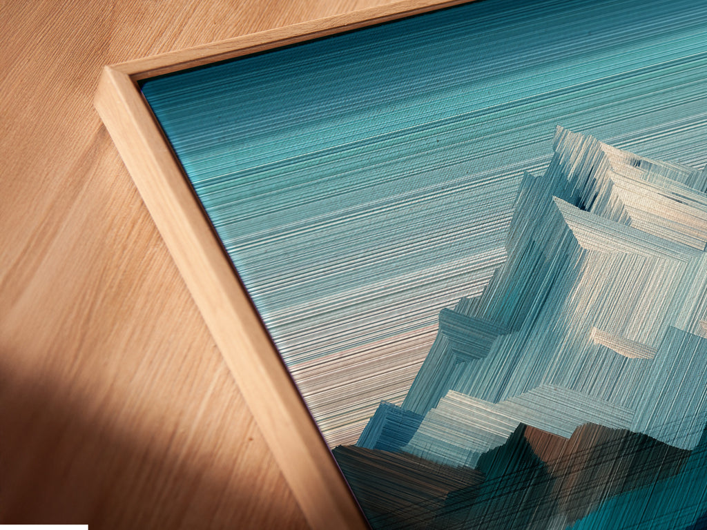 Angled close up shows a canvas print in a floating frame. This modern framing style gives a unique look. It makes the artwork appear to float. Explore canvas art with floating frames. Discover the details now