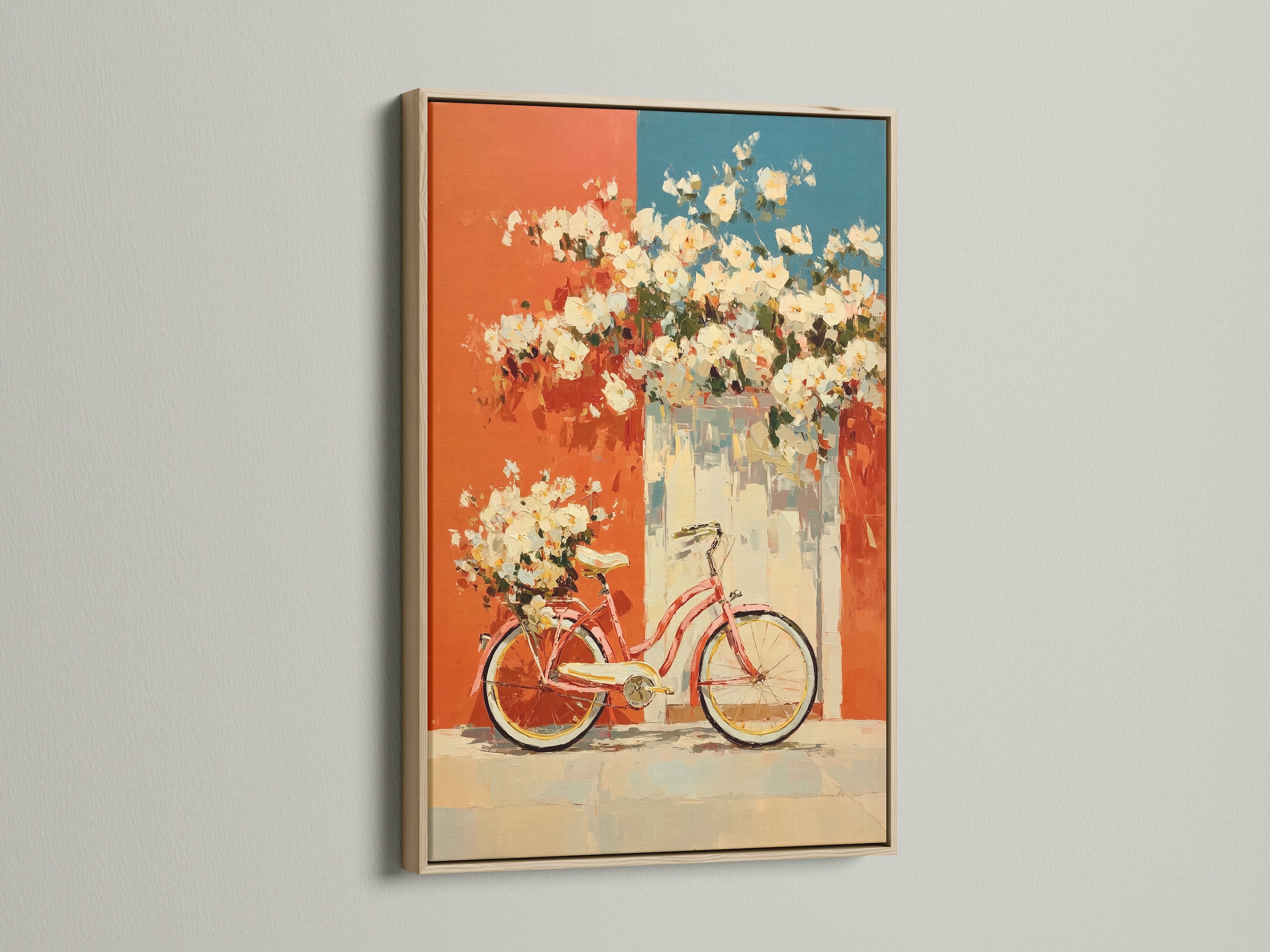 Vintage bicycle artwork displayed in an oak frame. The artwork features floral accents in coral and teal. This retro poster adds a touch of mid-century style to any kitchen or living room. The oak frame enhances the artwork’s vintage charm. It is perfect for adding a distinctive touch to your home decor.