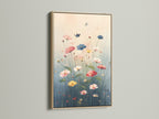 Floral Meadow canvas print with an oak frame. This botanical artwork adds a touch of nature to any room. Ideal for living rooms bedrooms and nurseries. The art features pink and blue hues for a serene aesthetic.