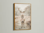 The vintage deer art with a bow tie is displayed in a gold frame. The gold frame enhances the artwork's vintage appeal. Perfect for creating a whimsical animal art display. It is great for nursery wall decor or bedroom wall decor. This artwork adds a touch of elegance to any room. The primary color is beige.