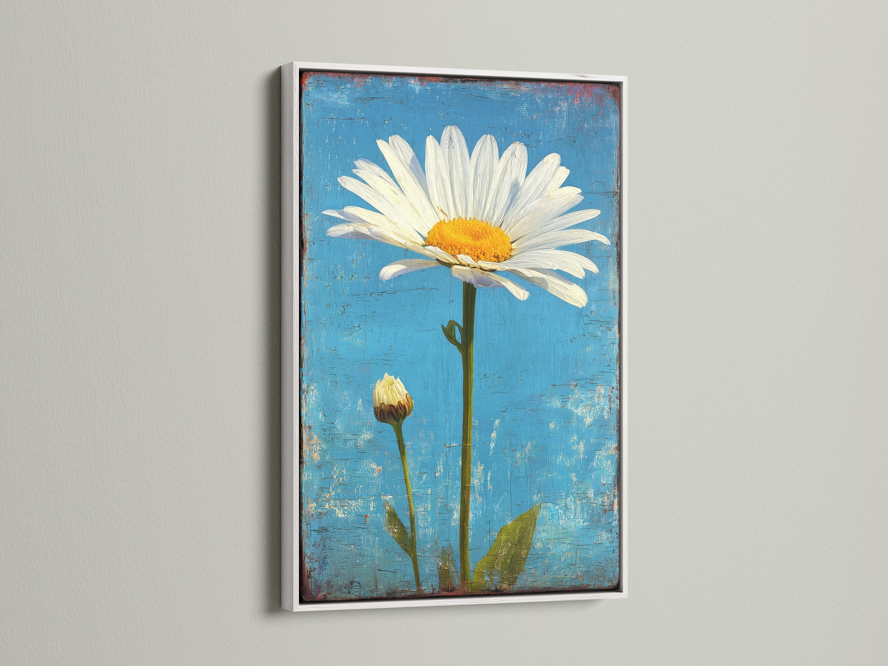 Artwork of a daisy flower and bud. The background is blue and the frame is white. The white frame enhances the vibrant colors of the artwork. Ideal for brightening up your home decor with floral art.
