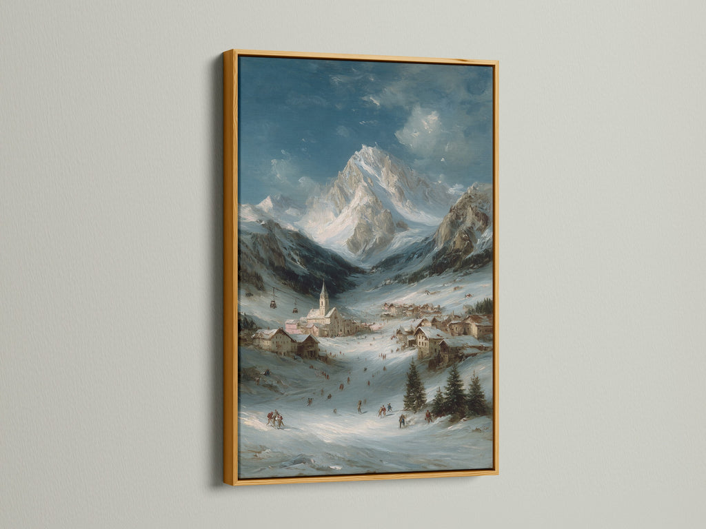 Alpine Village art print in a gold frame. The winter mountain landscape adds a touch of elegance. It is a perfect piece of mountain home decor. The snow scene print is great for creating a cozy atmosphere. The artwork has a lodge style.