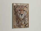 A captivating cheetah portrait is showcased in an oak frame. The safari animal print brings nature indoors. Add wildlife art to your space with this stunning African animal art. A great choice for office wall decor.