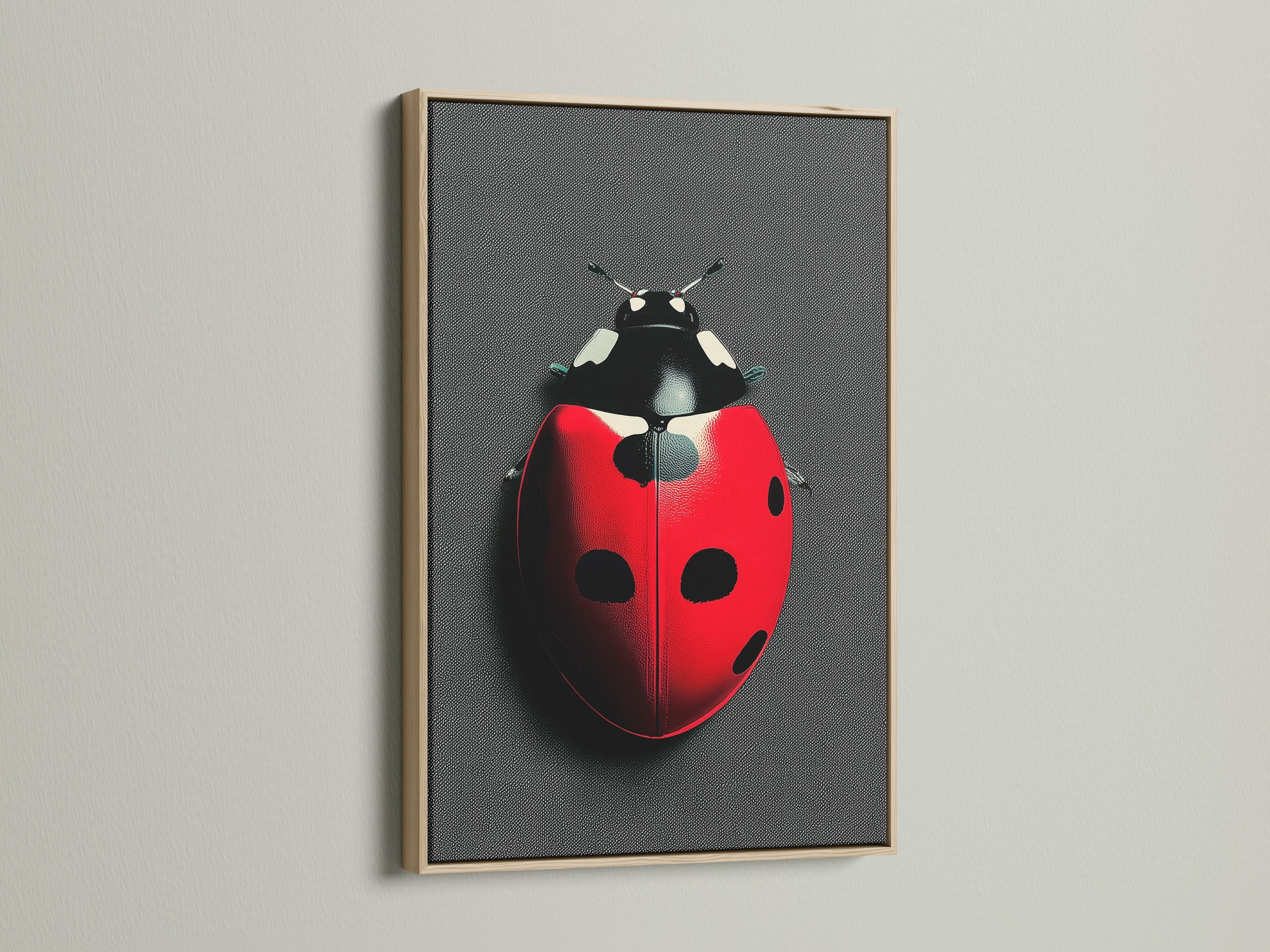 A close-up of a ladybug artwork in an oak frame. The red and black insect canvas print adds a touch of nature to any space. Ideal for homeowners renters and interior designers seeking modern wall art. Enhance your home decor with this beetle print.