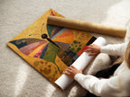 A woman is carefully rolling a fine art poster paper. The paper is handled with precision. It ensures top-notch quality and protection. The fine art poster paper is ready for framing.