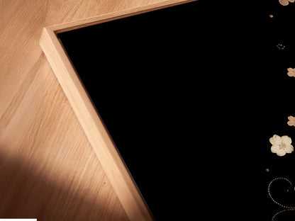 Close-up angled view of a canvas print. It's displayed in a floating frame. The artwork showcases beige flowers. This floral canvas is a great piece for modern wall decor in spas studios or clinics.