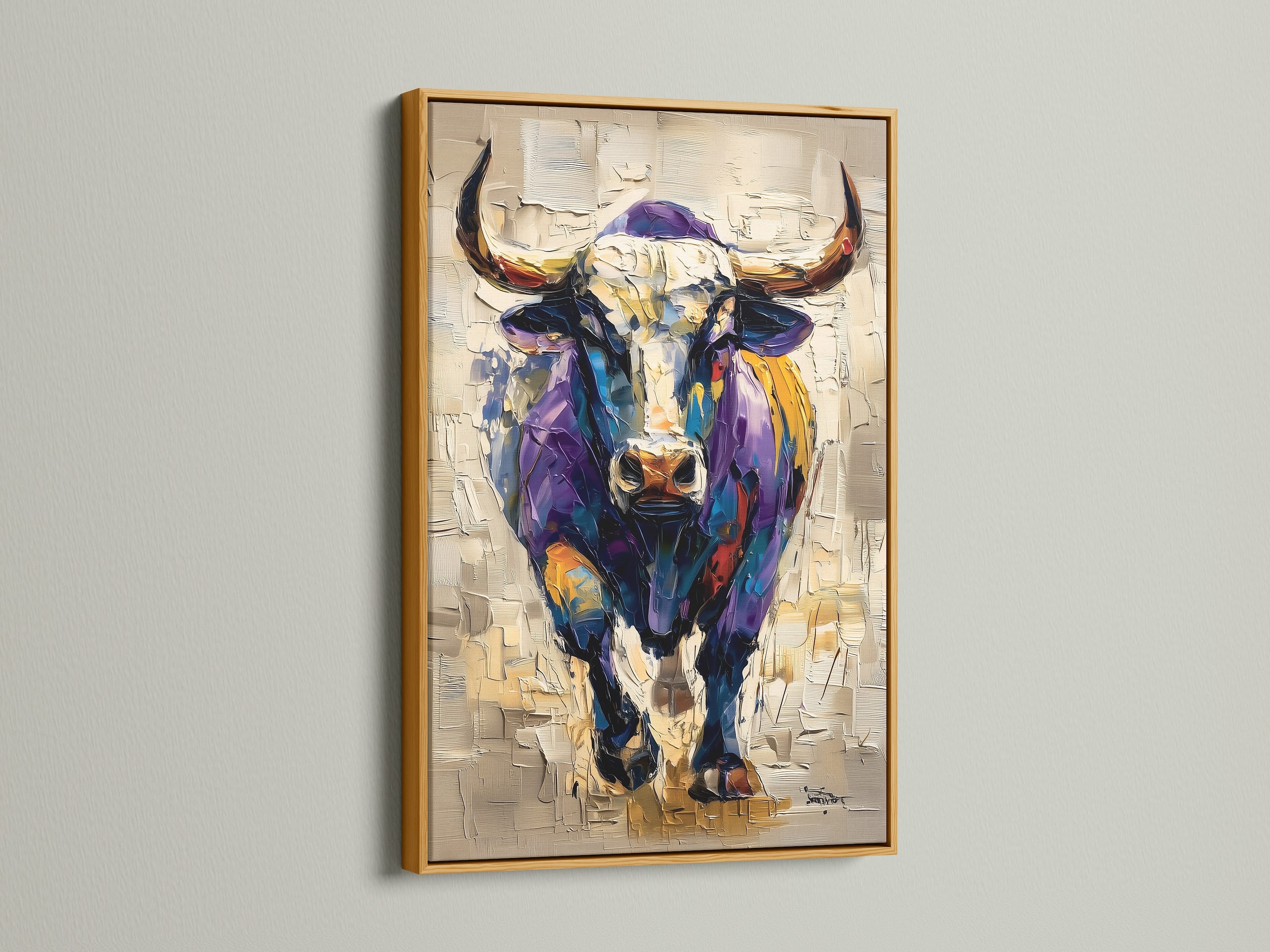 The artwork shows a bull in a gold frame. Gold frame adds a touch of luxury to the artwork. The bull is painted in bright shades. It is a statement piece that will elevate any room. Consider this piece to add a touch of glam to your space. This is perfect for any home.