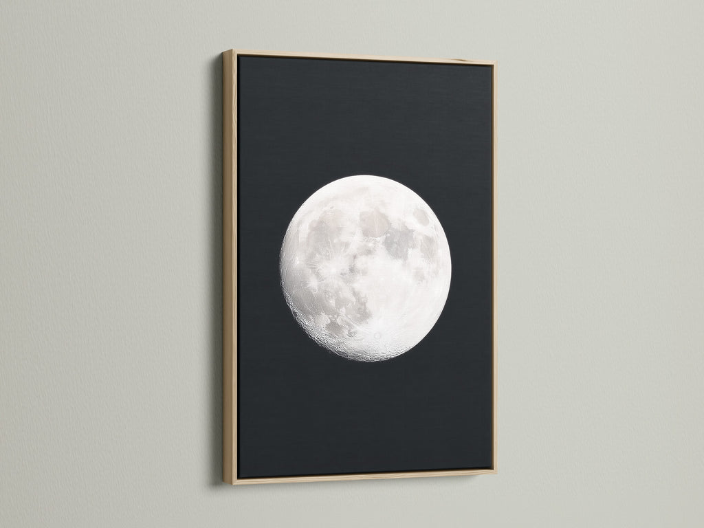 Full Moon lunar phase artwork with an oak frame. Ideal celestial wall art for bedroom astronomy decor. It's a great moon phase art piece. Perfect space themed art for modern aesthetics. It serves as an astrology gift and night sky print. A full moon artwork addition for celestial print lovers.