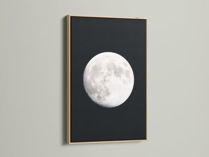 Full Moon lunar phase artwork with an oak frame. Ideal celestial wall art for bedroom astronomy decor. It's a great moon phase art piece. Perfect space themed art for modern aesthetics. It serves as an astrology gift and night sky print. A full moon artwork addition for celestial print lovers.