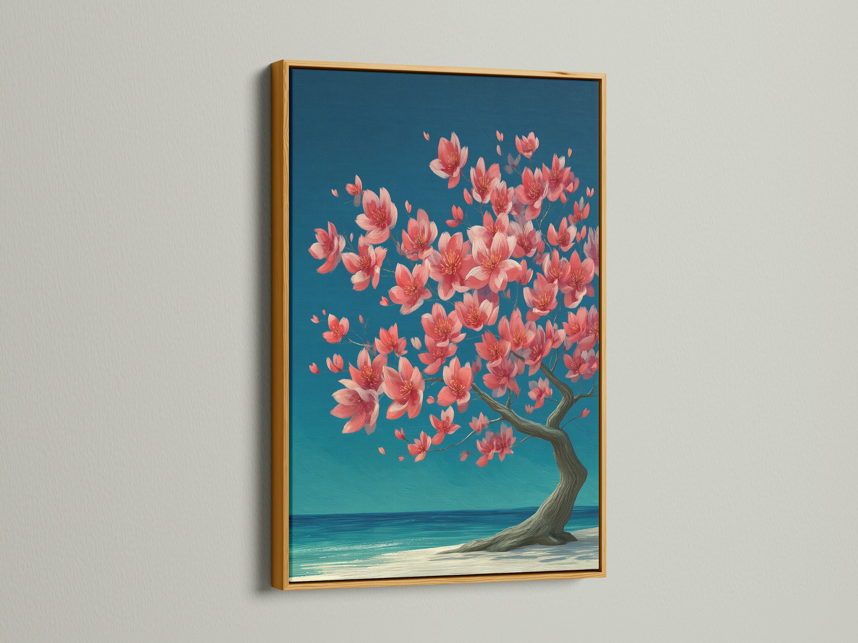 A gold frame enhances the cherry blossom tree artwork. The gold frame adds a touch of elegance. This artwork features coral pink florals and teal ocean hues. Perfect for coastal themed spaces.