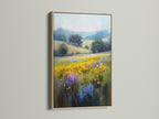 The wildflower meadow artwork is beautifully framed in oak. This country field painting brings nature indoors. The impressionist style captures the essence of a rustic landscape. Ideal for bedroom decor or living room wall art. This floral wall art complements farmhouse and eclectic styles.