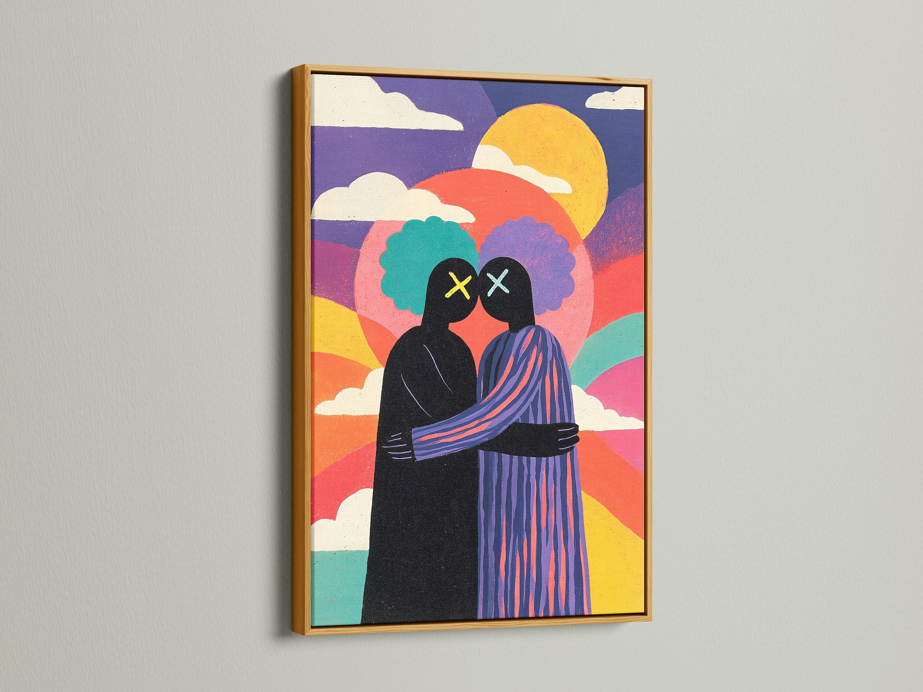 Framed artwork featuring two figures embracing. The art print has a gold frame. The artwork is colorful with a rainbow effect. This wall art adds a modern touch to any space. Explore framed art options.