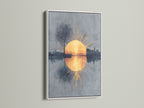 This modern artwork features a clean white frame. The sunrise reflection and abstract cityscape provide a serene focal point. The golden hour art brings a touch of tranquility to your living space. It enhances minimalist aesthetics.