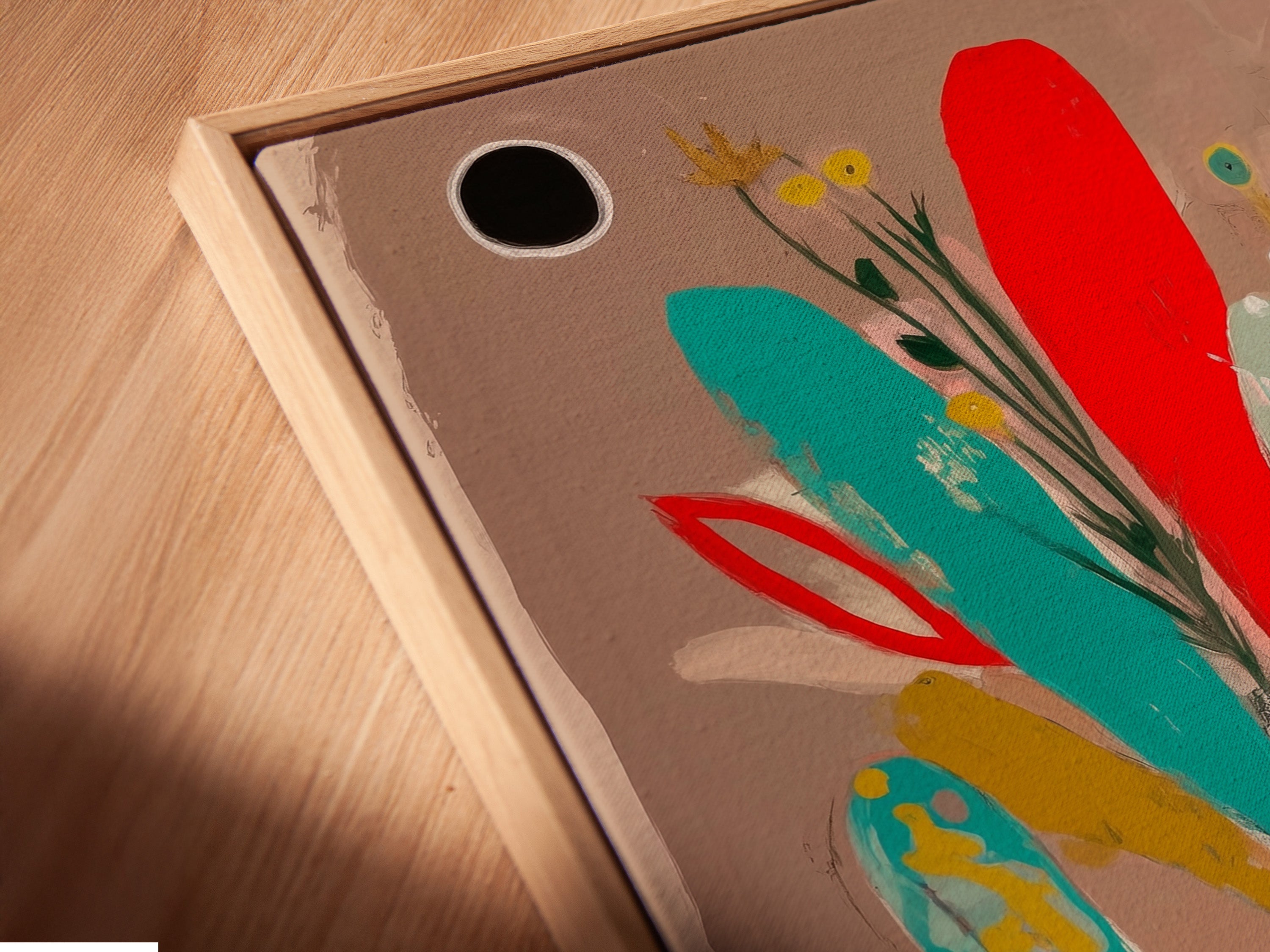 A close-up of a canvas print in a floating frame. It displays a folk art elephant artwork. The frame enhances its bohemian style and abstract details. It is suitable for modern eclectic decor.