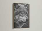 A striking wolf portrait canvas print displayed in an oak frame. The black and white wildlife art adds a touch of nature to any room. Perfect for rustic modern or minimalist interiors. Discover the beauty of animal artwork.