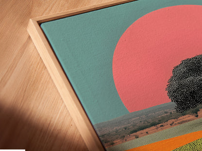 A close-up angled view reveals the texture of a canvas print within a floating frame. The Indian Village artwork showcases a retro sunset and desert landscape. It’s perfect for adding depth and global-inspired art to your living space.
