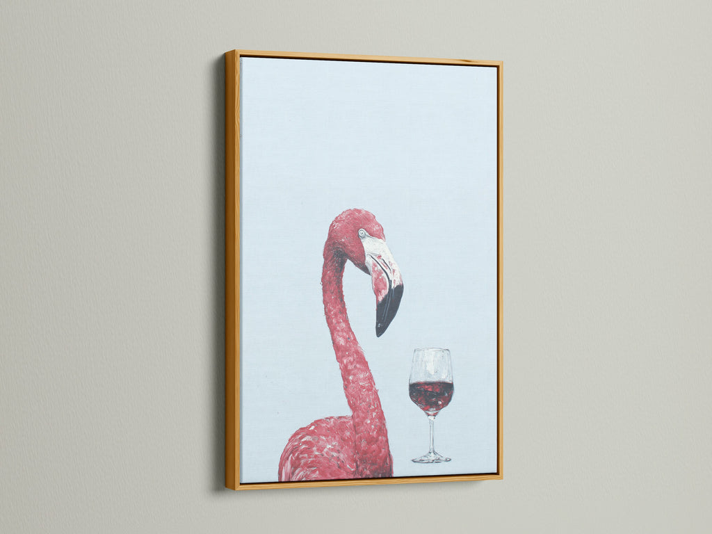 This pink flamingo art print is showcased in a gold frame. The wine art print brings a luxurious feel to your home bar. This tropical bird artwork is perfect for pink wall art.