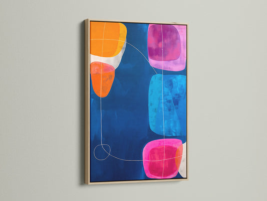 Abstract Geometric Artwork with an Oak Frame. The modern canvas art showcases a navy blue background with colorful geometric shapes. Perfect for adding a touch of contemporary art to your living room. This abstract artwork enhances minimalist and eclectic spaces