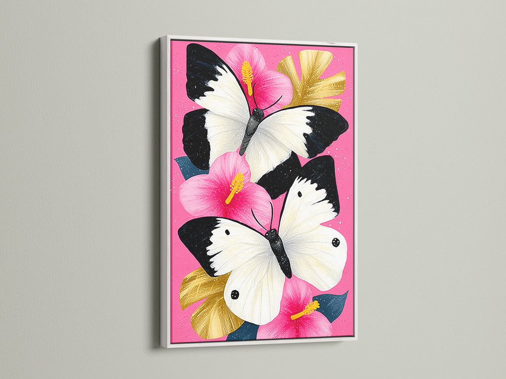 Butterfly Canvas Artwork with a White Frame. The artwork features a pink hibiscus wall art with white butterflies. Perfect as a nature artwork or botanical print. This canvas art is perfect for adding a modern touch to your home.