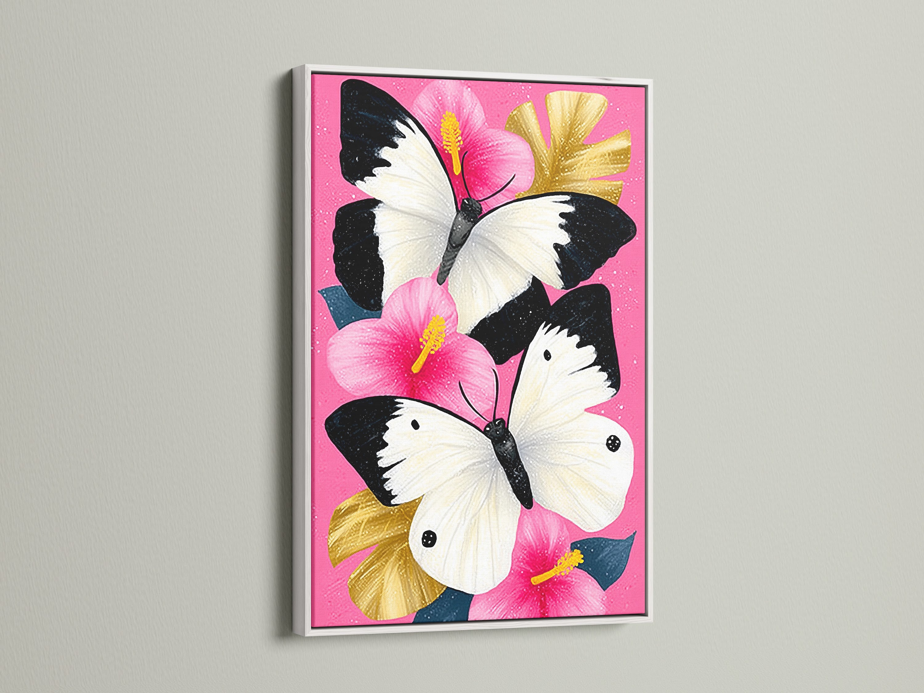 Butterfly Canvas Artwork with a White Frame. The artwork features a pink hibiscus wall art with white butterflies. Perfect as a nature artwork or botanical print. This canvas art is perfect for adding a modern touch to your home.