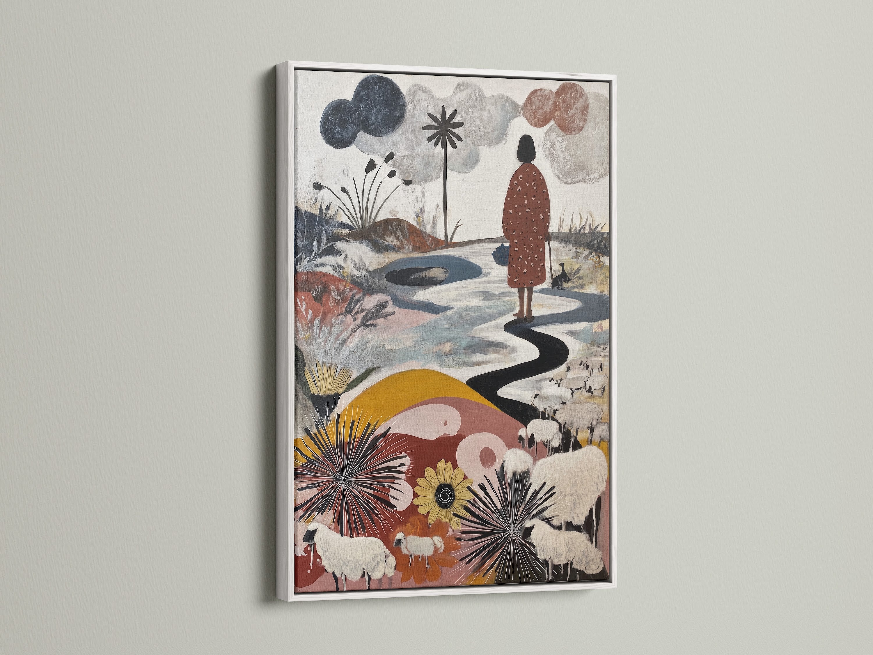 Artwork with a white frame hanging on a white wall. The artwork features a figure walking along a winding path. Sheep graze in a field of flowers. The white frame offers a clean modern look. See if the white frame suits your art.