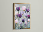 Artwork with a gold frame. The artwork features pink and purple tulips. Butterflies add a whimsical touch to the scene. The gold frame enhances the artwork's elegance creating a luxurious feel. The artwork is displayed on a neutral wall complementing its rich tones.